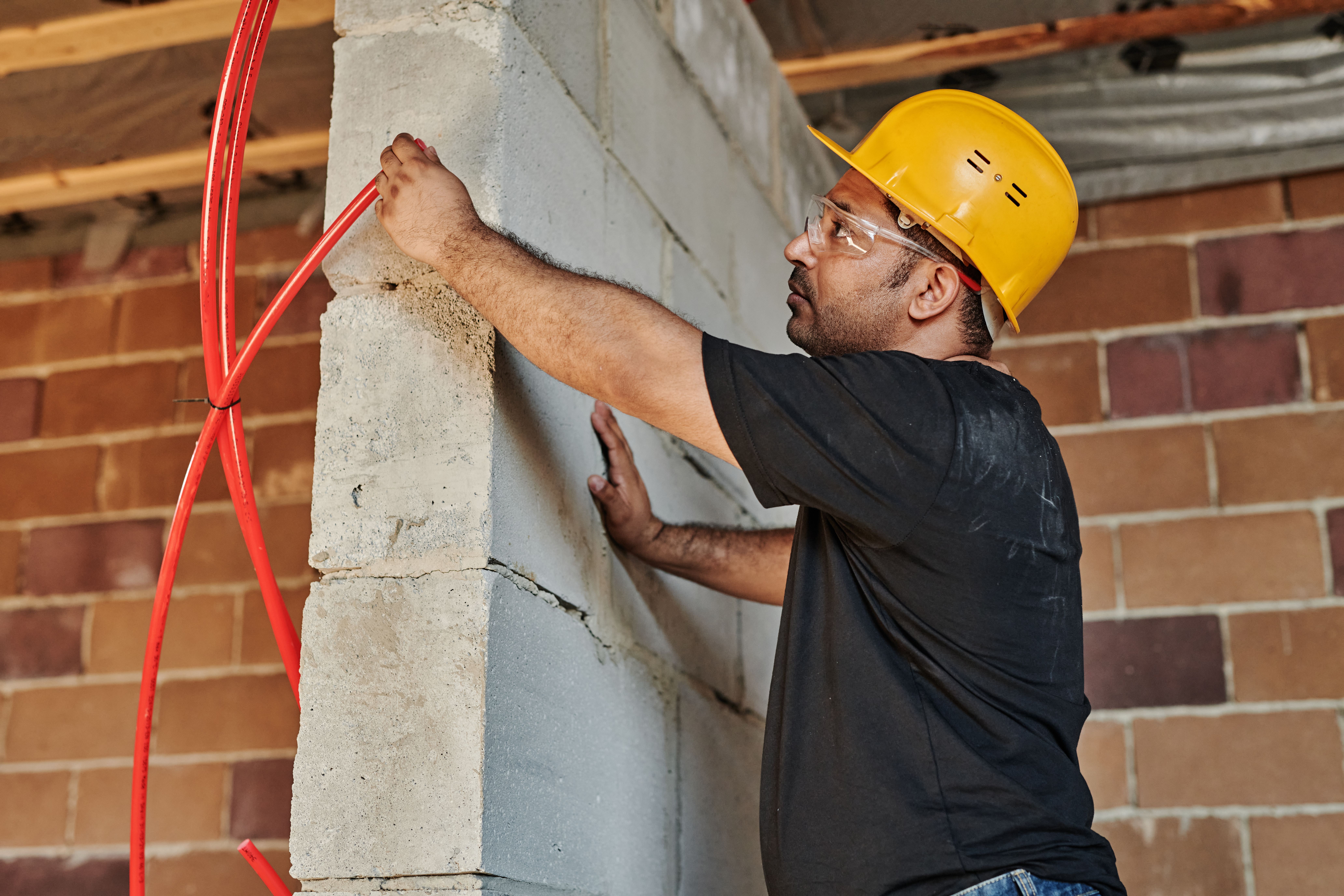 Professional electrician working on electrical panel